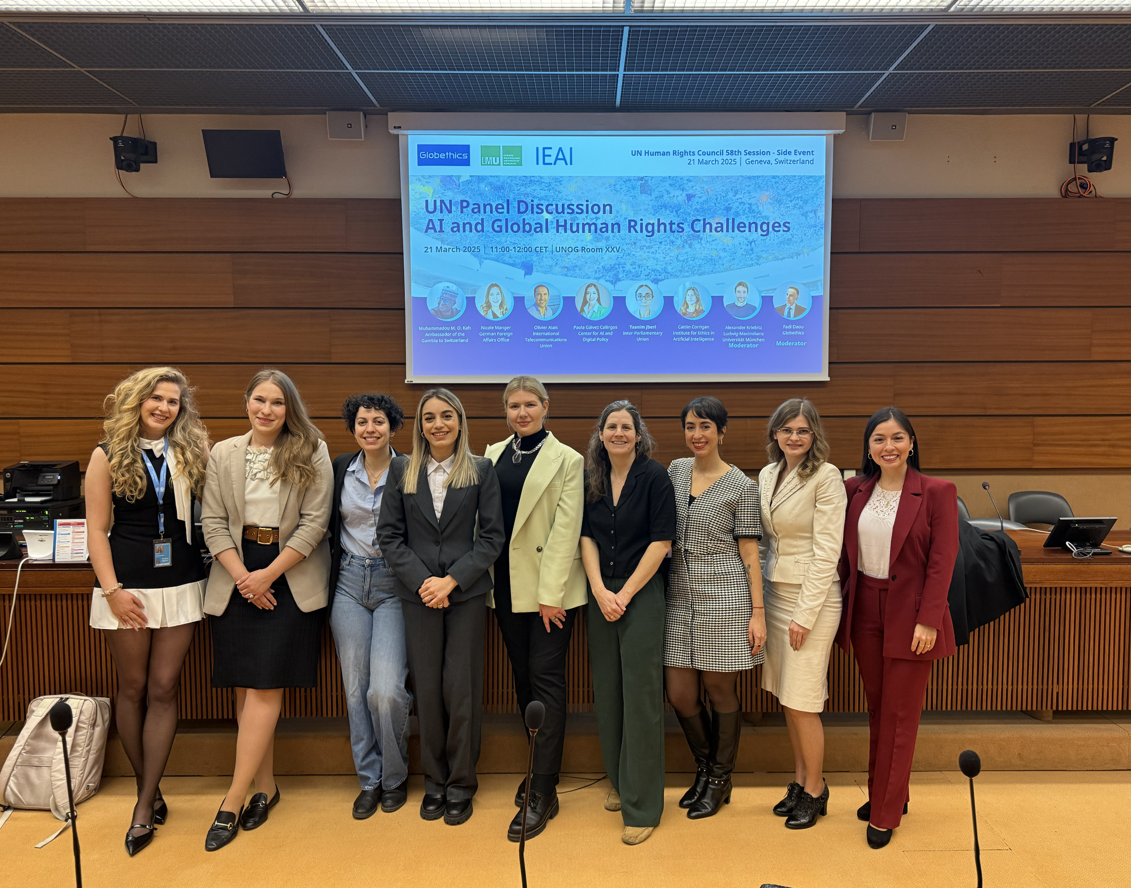 Panel members in front of the slide for the UN panel discussion on AI and global human rights challenges