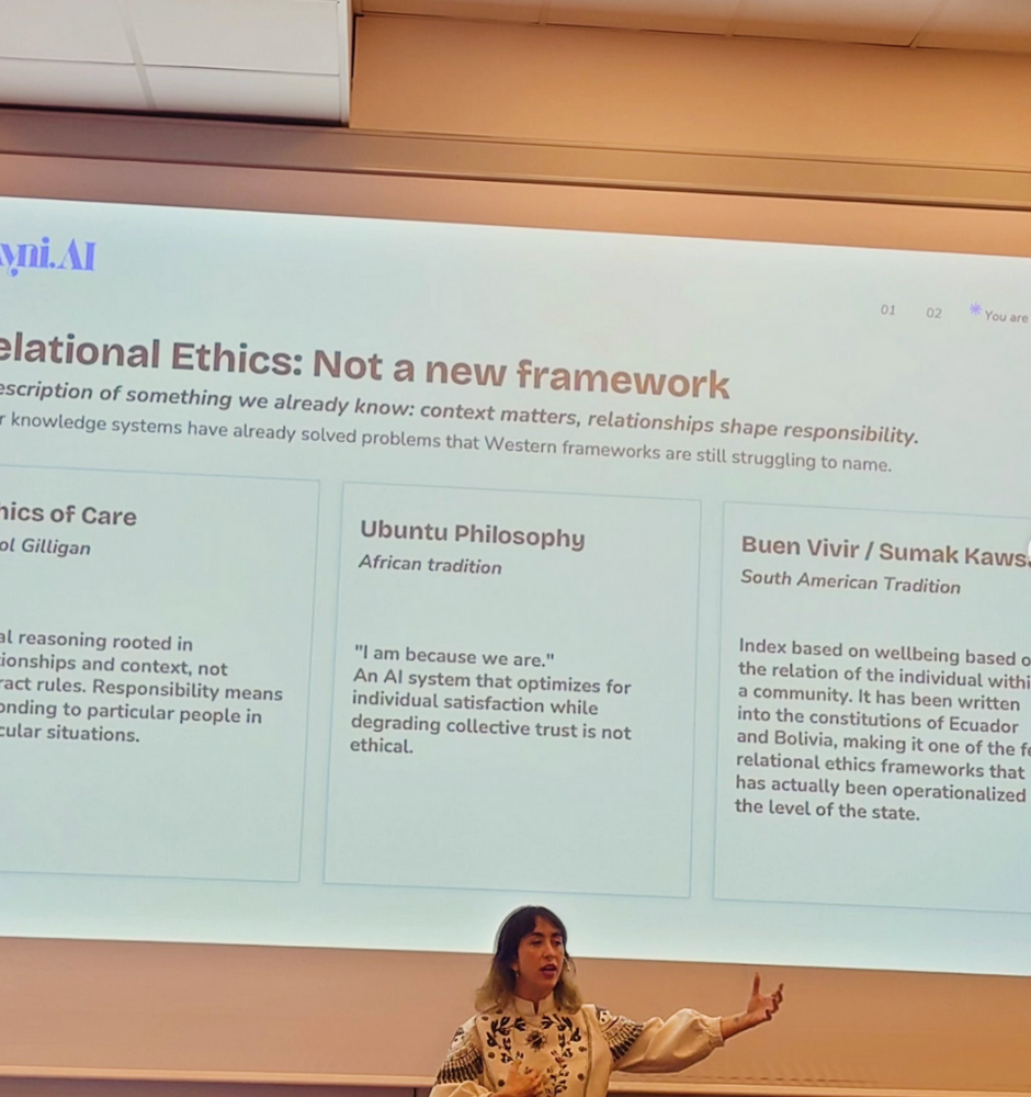 Camila speaking at the Kristiania AI Center launch, in front of a slide on relational ethics