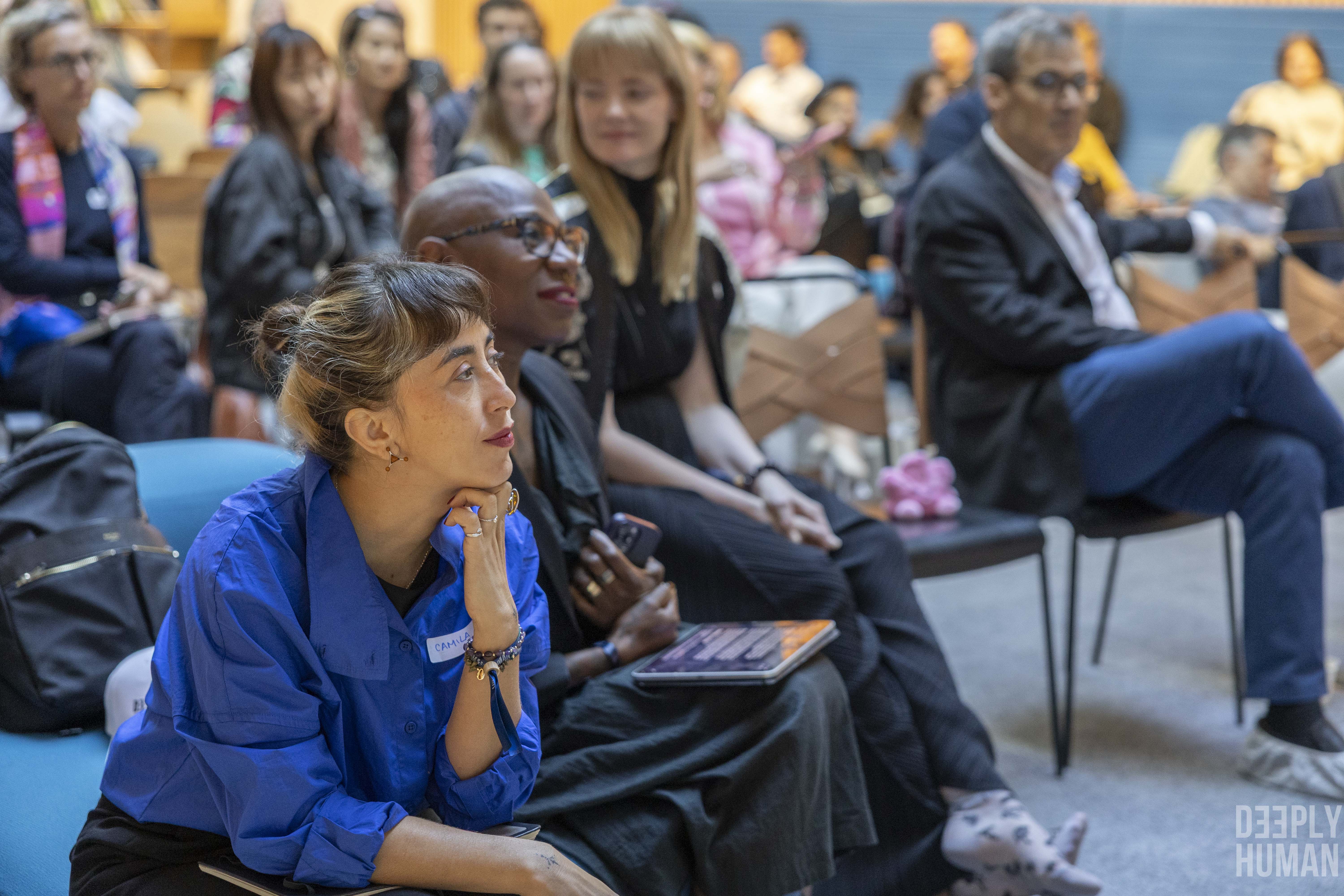 Camila listening at the Deeply Human Summit, Paris